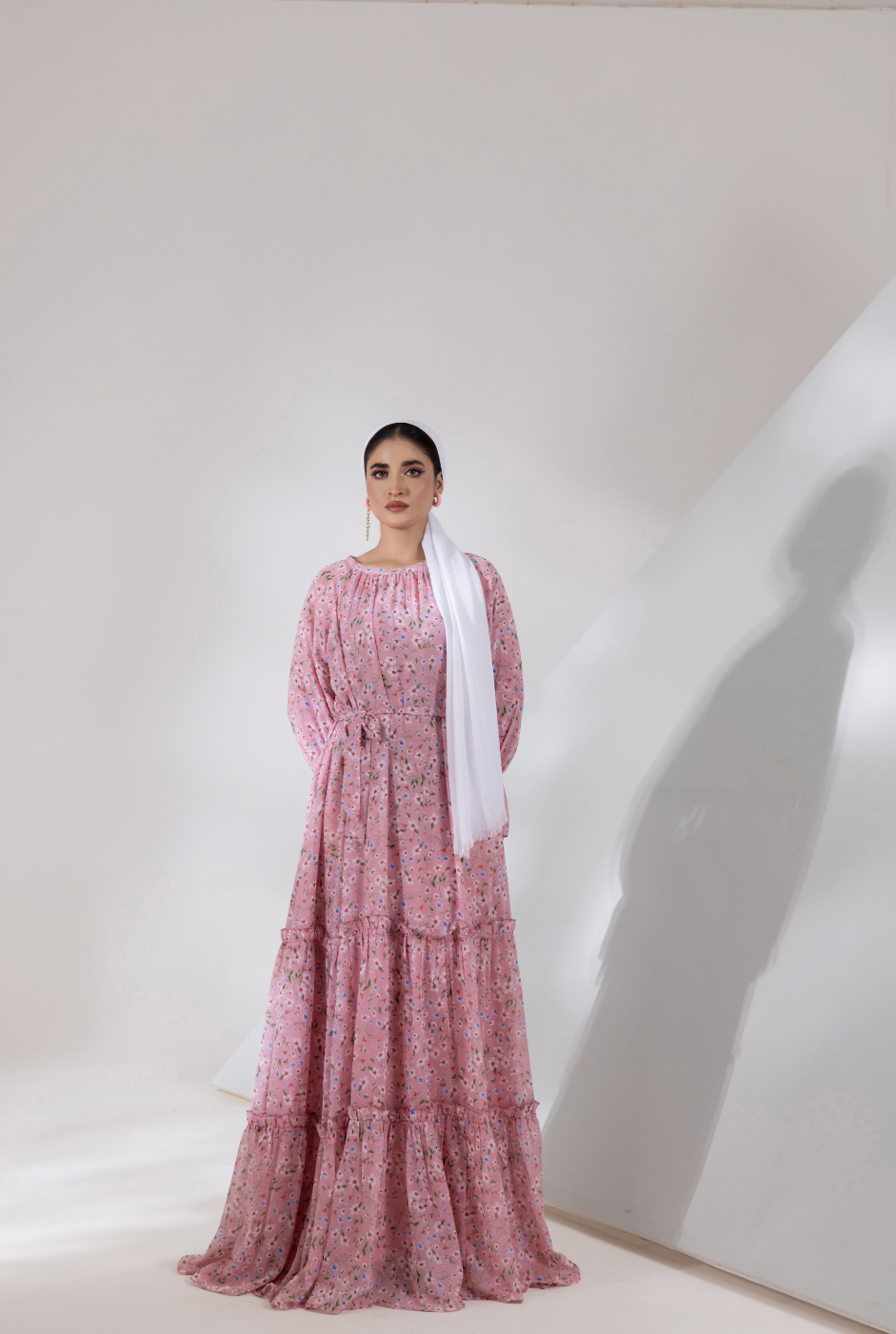 Front view, pink chiffon maxi dress with tiered flare and gathered bodice