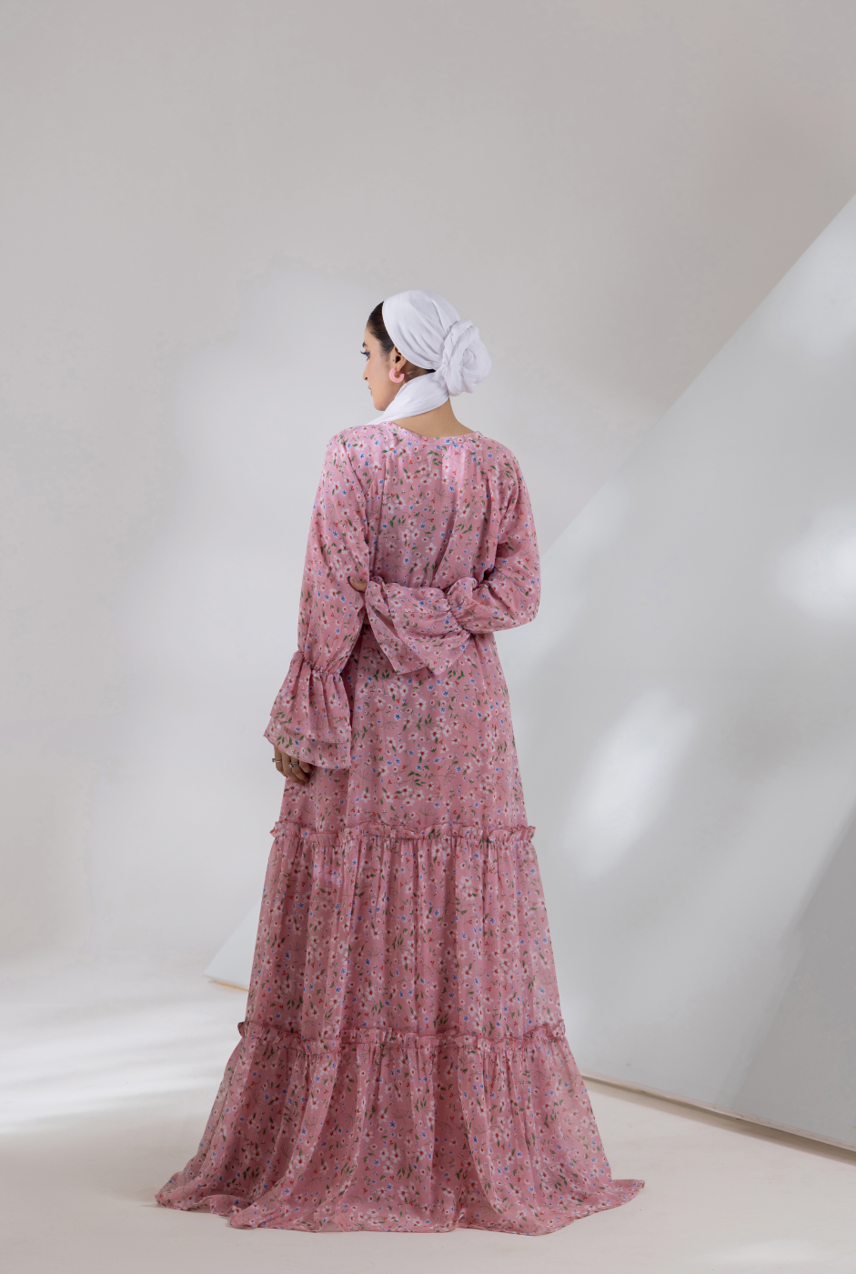 Front view, pink chiffon maxi dress with tiered flare and gathered bodice