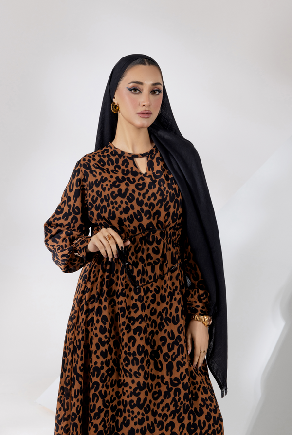 Close view,  black chiffon maxi dress with round V-cut neckline and bold print
