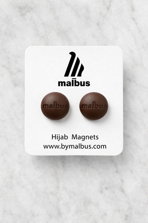 Mauve taupe hijab magnets from MALBUS displayed as a pair, showing smooth premium magnetic closures designed to secure hijabs without pins or damage to delicate fabrics