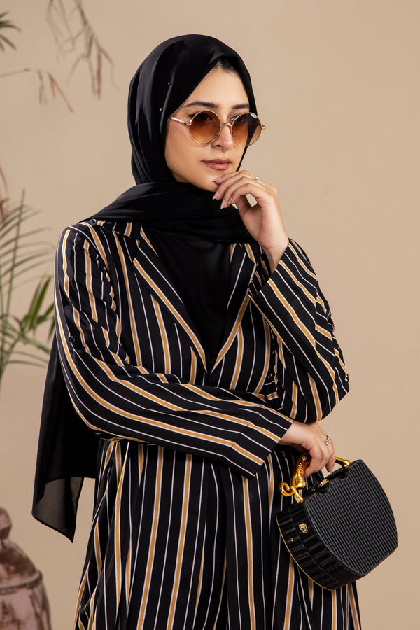 Close view of women’s jacket showing stripes and tie waist – co-ord set